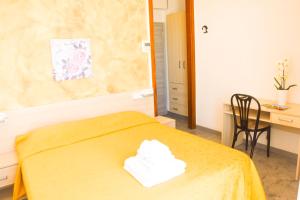 Postel nebo postele na pokoji v ubytování Hotel Suprem sul Mare
