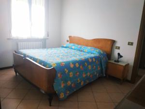 Letto o letti in una camera di B&B L'uva Fragolina
