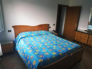 Letto o letti in una camera di B&B L'uva Fragolina