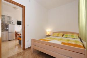 Postel nebo postele na pokoji v ubytování Apartments Vlado i Vesna