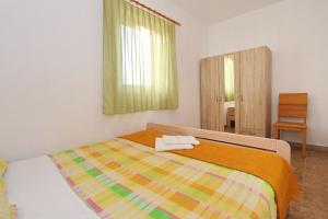 Postel nebo postele na pokoji v ubytování Apartments Vlado i Vesna