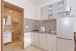 Kuchyň nebo kuchyňský kout v ubytování Apartments Vlado i Vesna