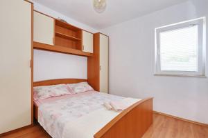 Postel nebo postele na pokoji v ubytování Apartments Vlado i Vesna