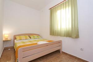 Postel nebo postele na pokoji v ubytování Apartments Vlado i Vesna