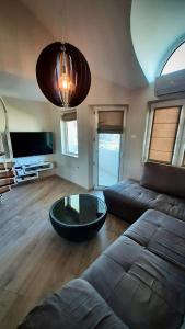 a living room with a couch and a coffee table at Centrally Located Apartment in Varna in Varna City