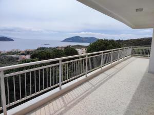 a balcony with a view of the ocean at THEA COURT Clio & Erato Apartments in Paleo Tsifliki