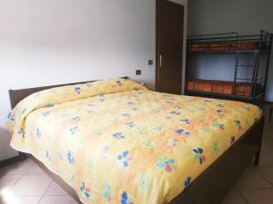 Letto o letti in una camera di B&B L'uva Fragolina
