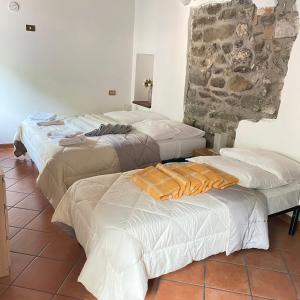 Postel nebo postele na pokoji v ubytování In Castello