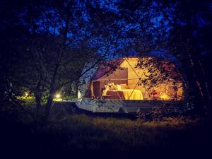 a tent in the middle of a field at night at Teapot Lane Glamping - Adults only in Sligo