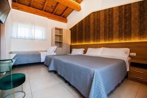 Postel nebo postele na pokoji v ubytování Gu Hotel