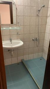 a bathroom with a sink and a shower at Guest House Katya in Nesebar +36 photos