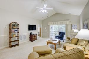 a living room with a couch and a table at Magnolia Pointe 305 in Myrtle Beach