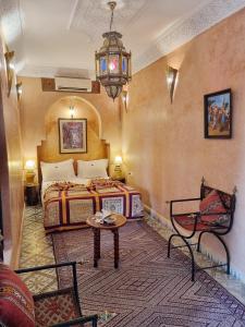 Postel nebo postele na pokoji v ubytování Riad Adriana