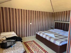 Posteľ alebo postele v izbe v ubytovaní wadi rum land mars