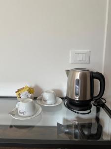 Příslušenství pro přípravu čaje a kávy v ubytování Albergo Wellness Da Febo