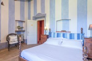 Posteľ alebo postele v izbe v ubytovaní PODERE PRATOVECCHIO 14&2, Emma Villas