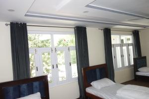 Postel nebo postele na pokoji v ubytování Alpen Hotel Skardu