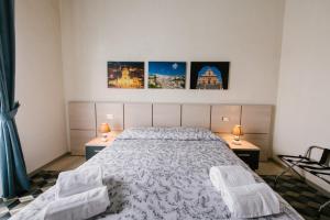 A bed or beds in a room at Le Camere dei Conti