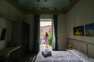 A bed or beds in a room at Le Camere dei Conti