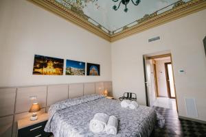 A bed or beds in a room at Le Camere dei Conti