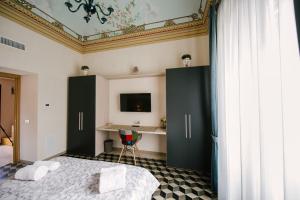 A bed or beds in a room at Le Camere dei Conti