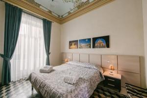 A bed or beds in a room at Le Camere dei Conti