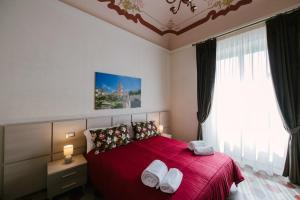 A bed or beds in a room at Le Camere dei Conti