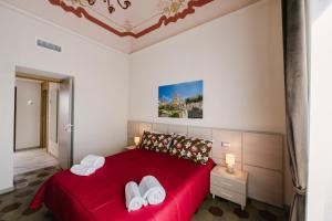 A bed or beds in a room at Le Camere dei Conti
