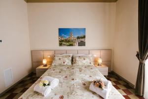 A bed or beds in a room at Le Camere dei Conti