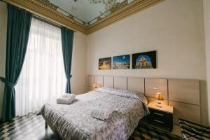 A bed or beds in a room at Le Camere dei Conti