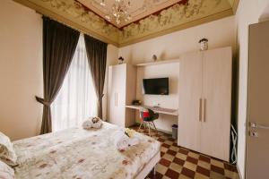A bed or beds in a room at Le Camere dei Conti
