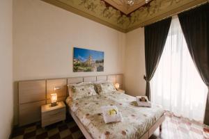 A bed or beds in a room at Le Camere dei Conti