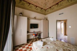A bed or beds in a room at Le Camere dei Conti