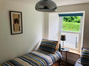Postel nebo postele na pokoji v ubytování Mount Cottage