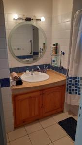 a bathroom with a sink and a mirror at Adarissa House in Rabat