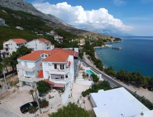 an aerial view of a town next to the water at Apartments Gordana in Lokva Rogoznica