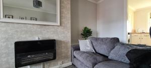 TV a/nebo společenská místnost v ubytování Beautiful 2-Bed Apartment in Campbeltown