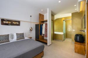 Postel nebo postele na pokoji v ubytování Alizea Villas & Suites