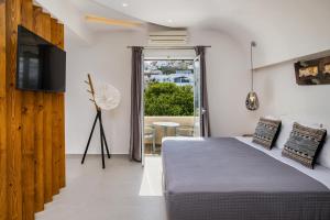 Postel nebo postele na pokoji v ubytování Alizea Villas & Suites