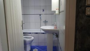 a bathroom with a sink and a toilet at HOPE HOUSE in Kavála