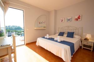 Postel nebo postele na pokoji v ubytování Casa David by Sonne Villas + 27 fotografií