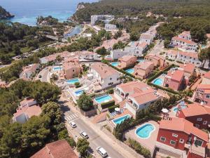 an aerial view of a home with a swimming pool at Villa Magnolia by Sonne Villas in Cala Galdana