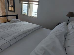Letto o letti in una camera di Blue View