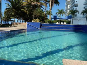 Bazén v ubytování Playa Azul Suites nebo v jeho okolí