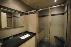 a bathroom with a sink and a shower at Résidence Gray d'Albion 2P NAP558 in Cannes +6 photos