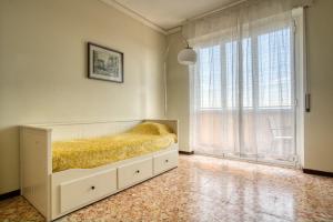 Tempat tidur dalam kamar di CaseOspitali - Casa Luce, a due passi dal San Raffaele
