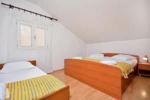 Posteľ alebo postele v izbe v ubytovaní 2-bedroom apartment with large terrace 3558-1