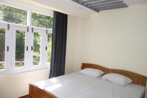 Postel nebo postele na pokoji v ubytování Alpen Hotel Skardu