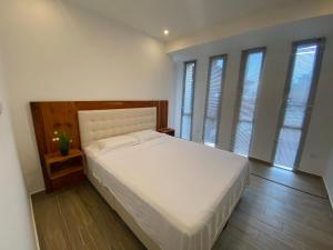 Postel nebo postele na pokoji v ubytování Playa Azul Suites