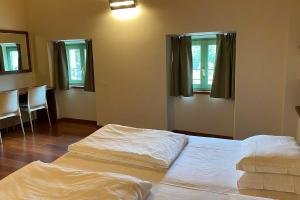 A bed or beds in a room at Residence delle Tre Corone